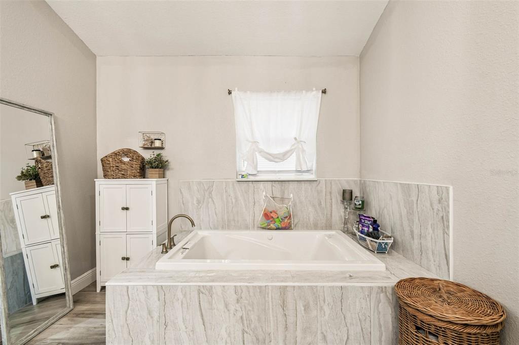 748 McClellan Road Frostproof, FL 33843 - Photo 24 of 31 a bathroom with a sink and a toilet