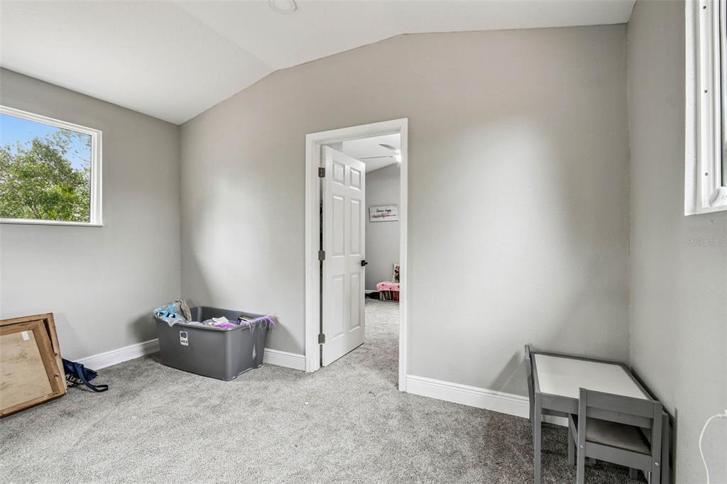 748 McClellan Road Frostproof, FL 33843 - Photo 26 of 31 a view of a hallway with workspace and a window