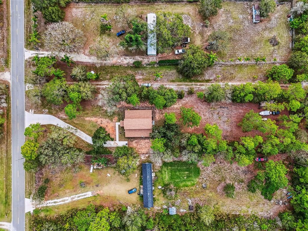 748 McClellan Road Frostproof, FL 33843 - Photo 29 of 31 an aerial view of residential house with outdoor space