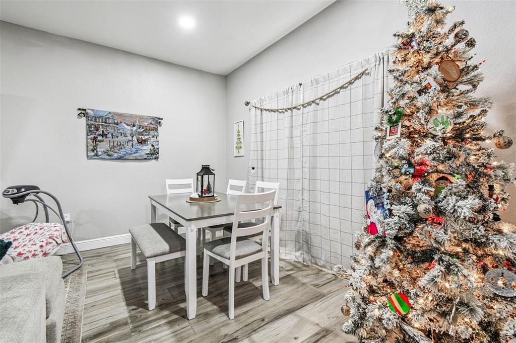 748 McClellan Road Frostproof, FL 33843 - Photo 30 of 31 a view of a dining room with furniture and chandelier