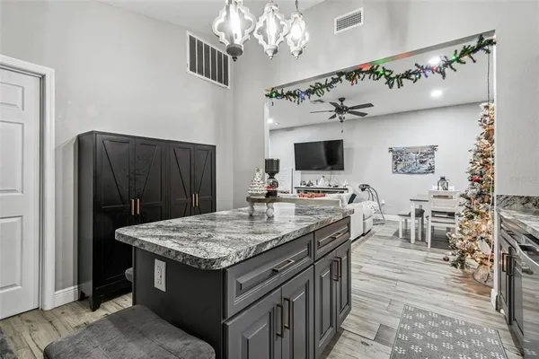 a kitchen with a table and chairs in it