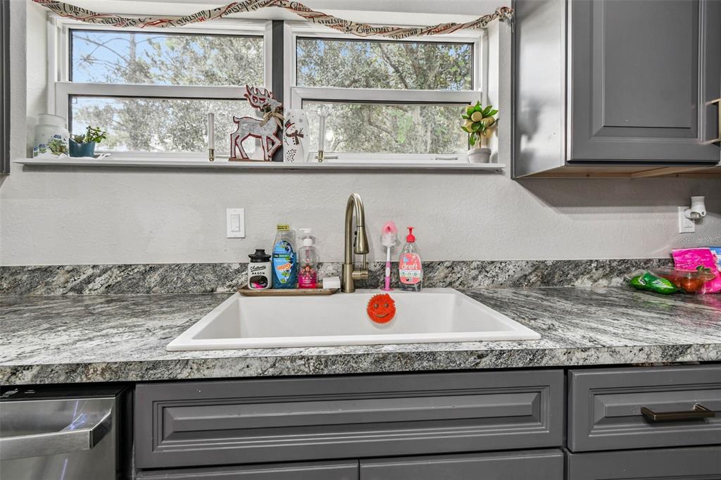 748 McClellan Road Frostproof, FL 33843 - Photo 10 of 31 a sink with kitchen island