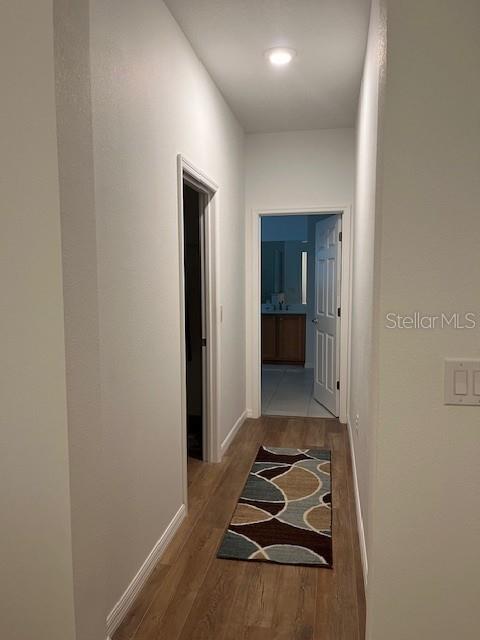 7882 Southwest 85th Loop Ocala, FL 34476 - Photo 14 of 27 a room with bed and mirror