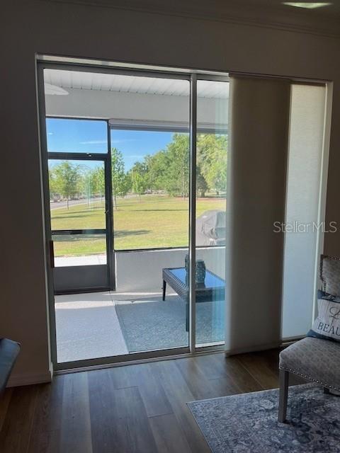 7882 Southwest 85th Loop Ocala, FL 34476 - Photo 20 of 27 a view of an empty room with glass door and a window