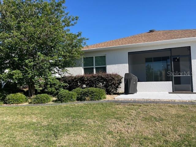 7882 Southwest 85th Loop Ocala, FL 34476 - Photo 24 of 27 a front view of a house with garden