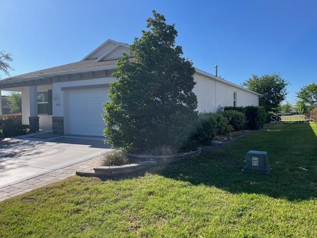 7882 Southwest 85th Loop Ocala, FL 34476 - Photo 3 of 27 a backyard of a house with lots of green space