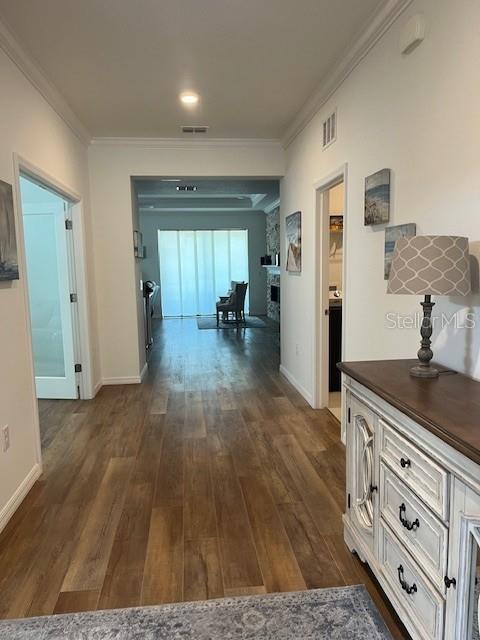 7882 Southwest 85th Loop Ocala, FL 34476 - Photo 6 of 27 a hall with cabinets and wooden floor