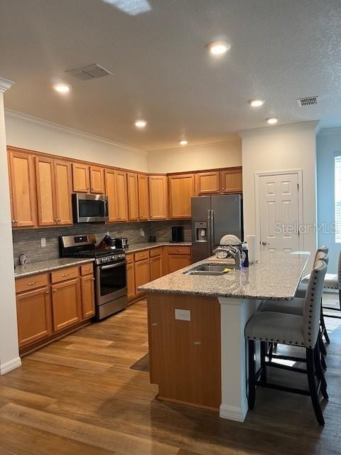 7882 Southwest 85th Loop Ocala, FL 34476 - Photo 7 of 27 a kitchen with stainless steel appliances granite countertop a stove and a sink
