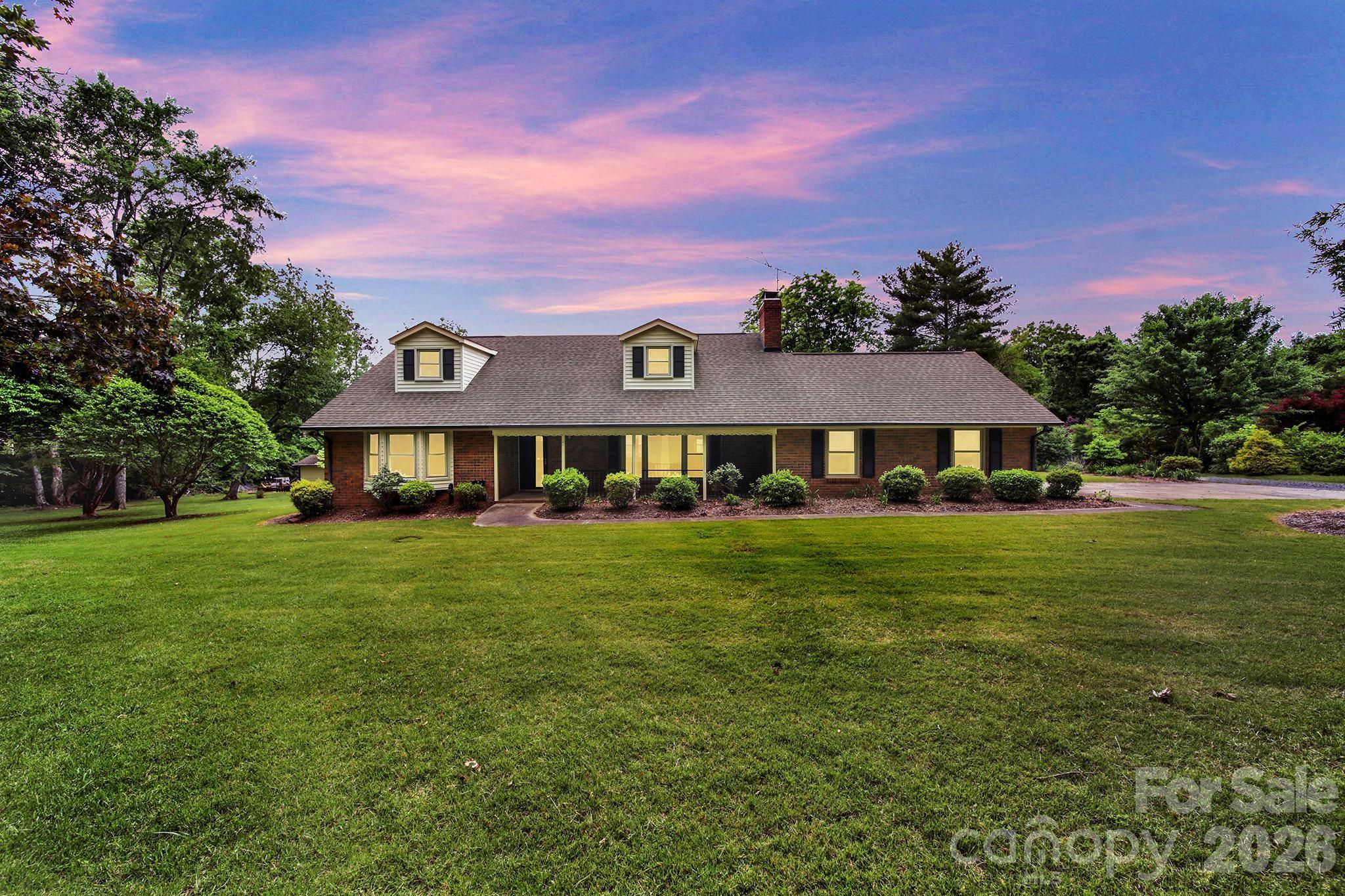 5913 Tom Query Road Charlotte, NC 28213 - Photo 2 of 47 a front view of a house with a garden