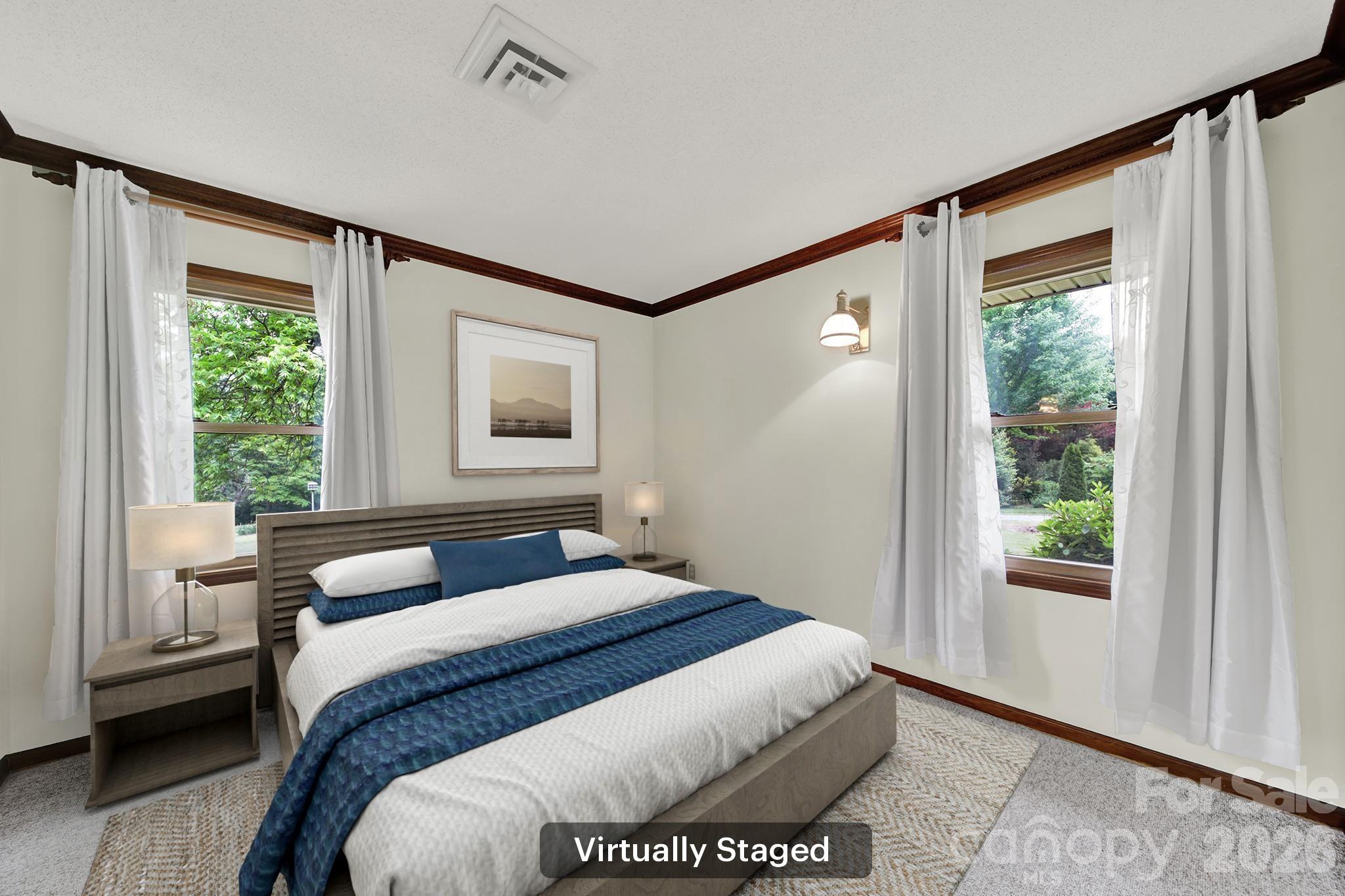 5913 Tom Query Road Charlotte, NC 28213 - Photo 23 of 47 a bedroom with a large bed and a window