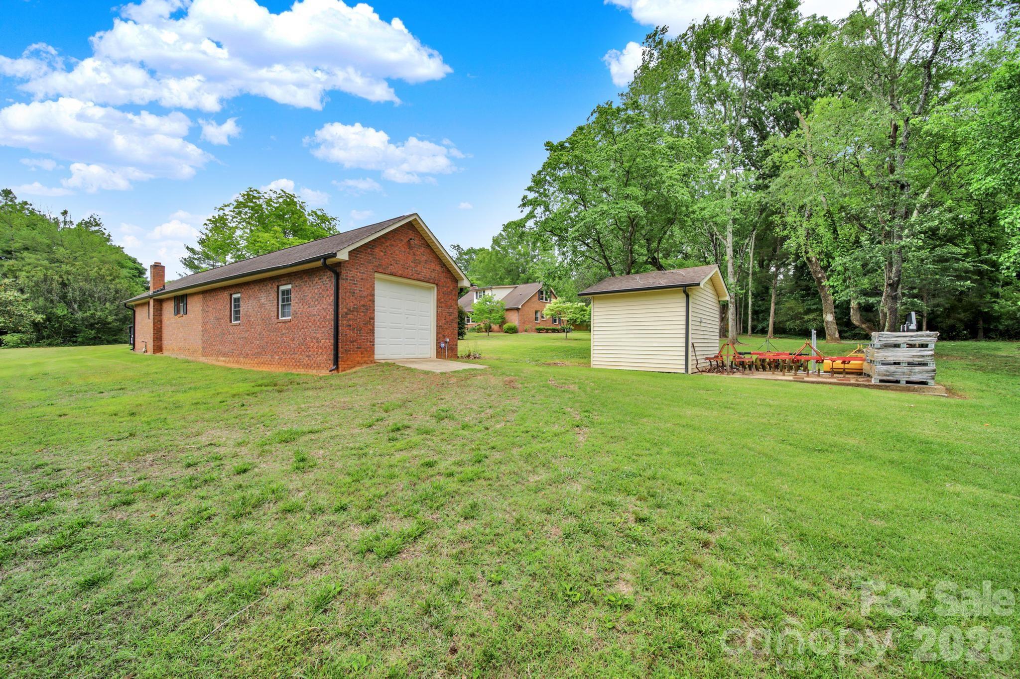 5913 Tom Query Road Charlotte, NC 28213 - Photo 35 of 47 a view of a house with backyard and garden