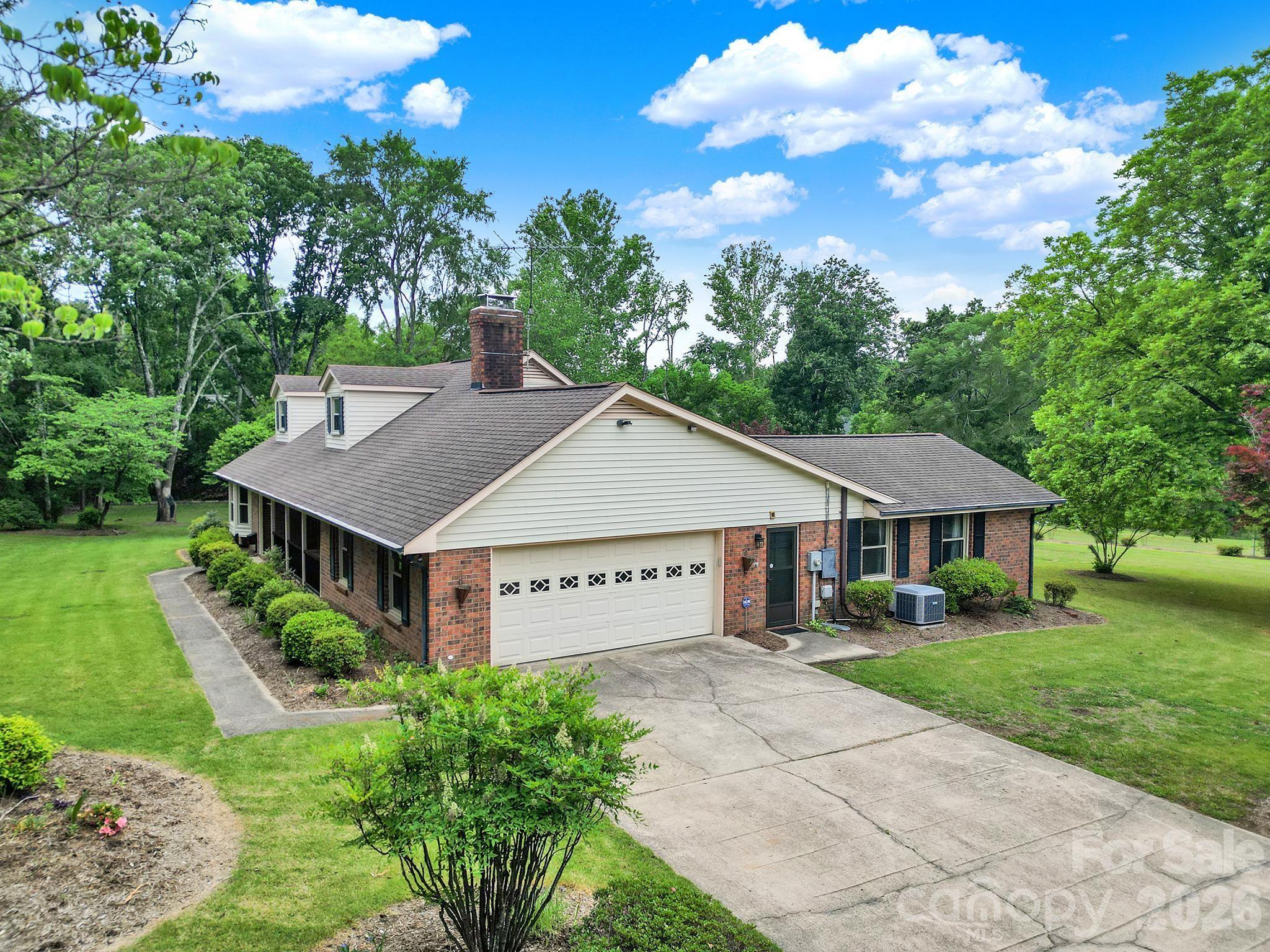 5913 Tom Query Road Charlotte, NC 28213 - Photo 40 of 47 a view of a house with a big yard plants and large tree