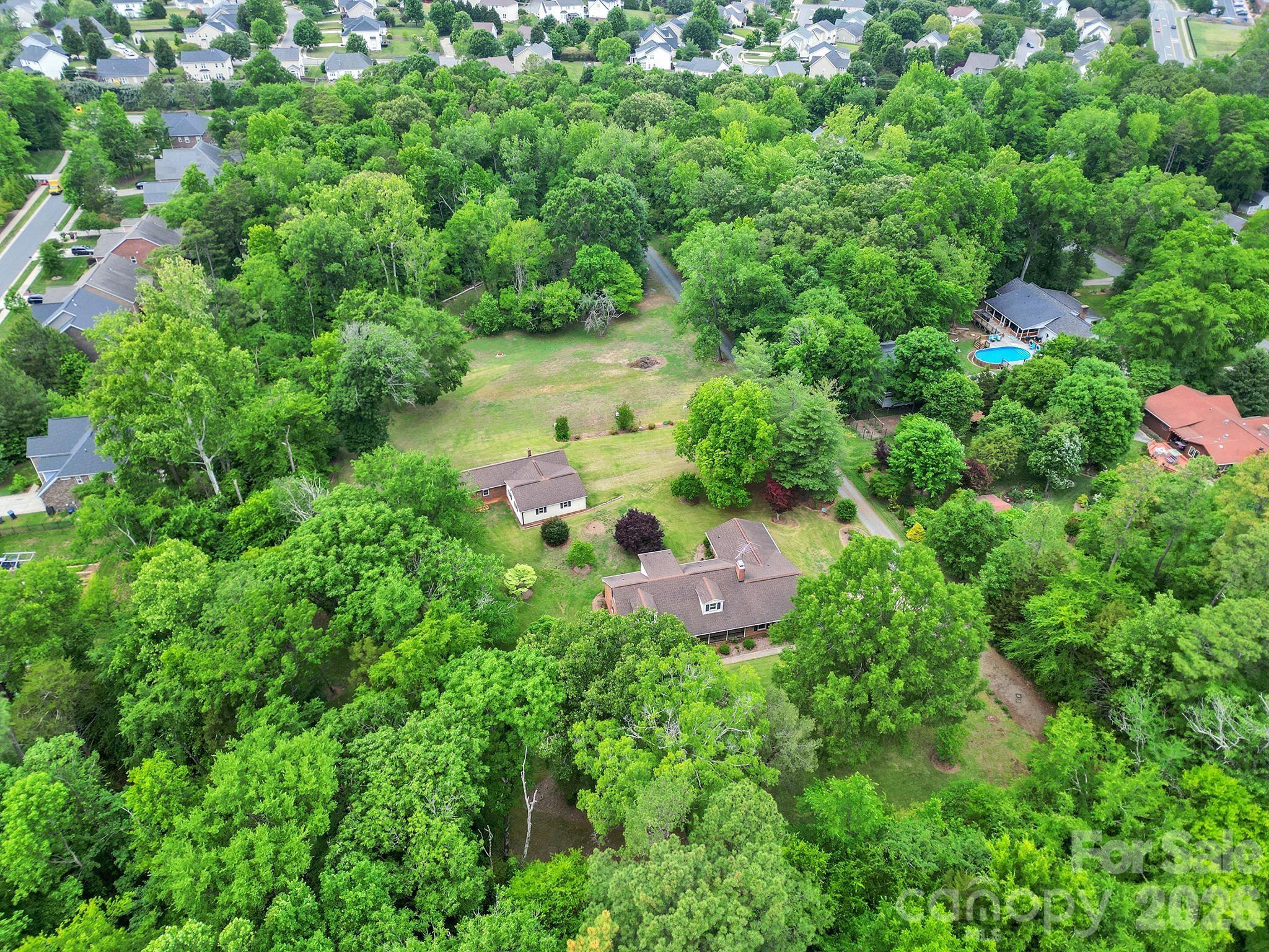 5913 Tom Query Road Charlotte, NC 28213 - Photo 44 of 47 an aerial view of residential house with outdoor space and trees all around