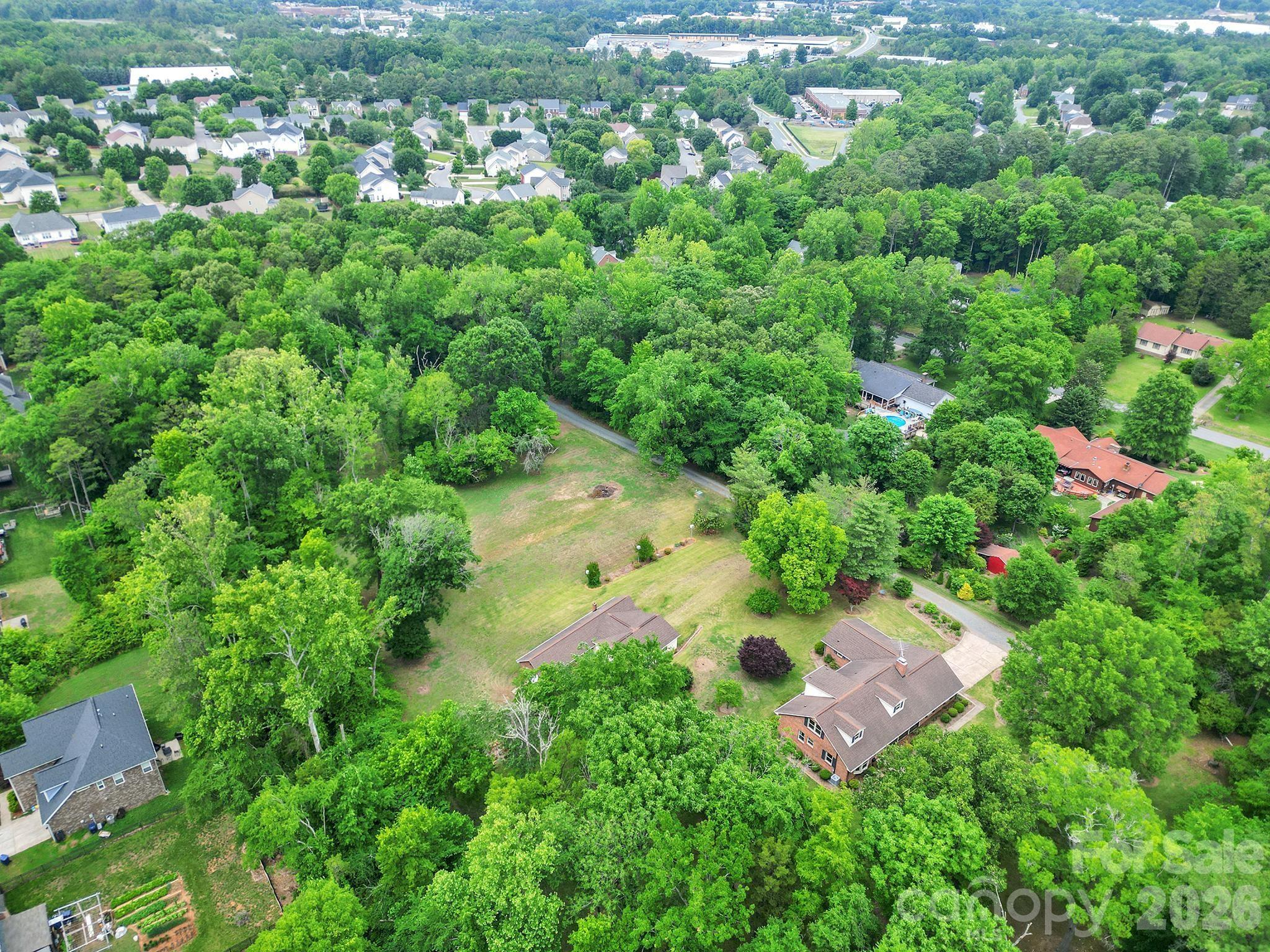 5913 Tom Query Road Charlotte, NC 28213 - Photo 45 of 47 an aerial view of residential house with outdoor space and trees all around