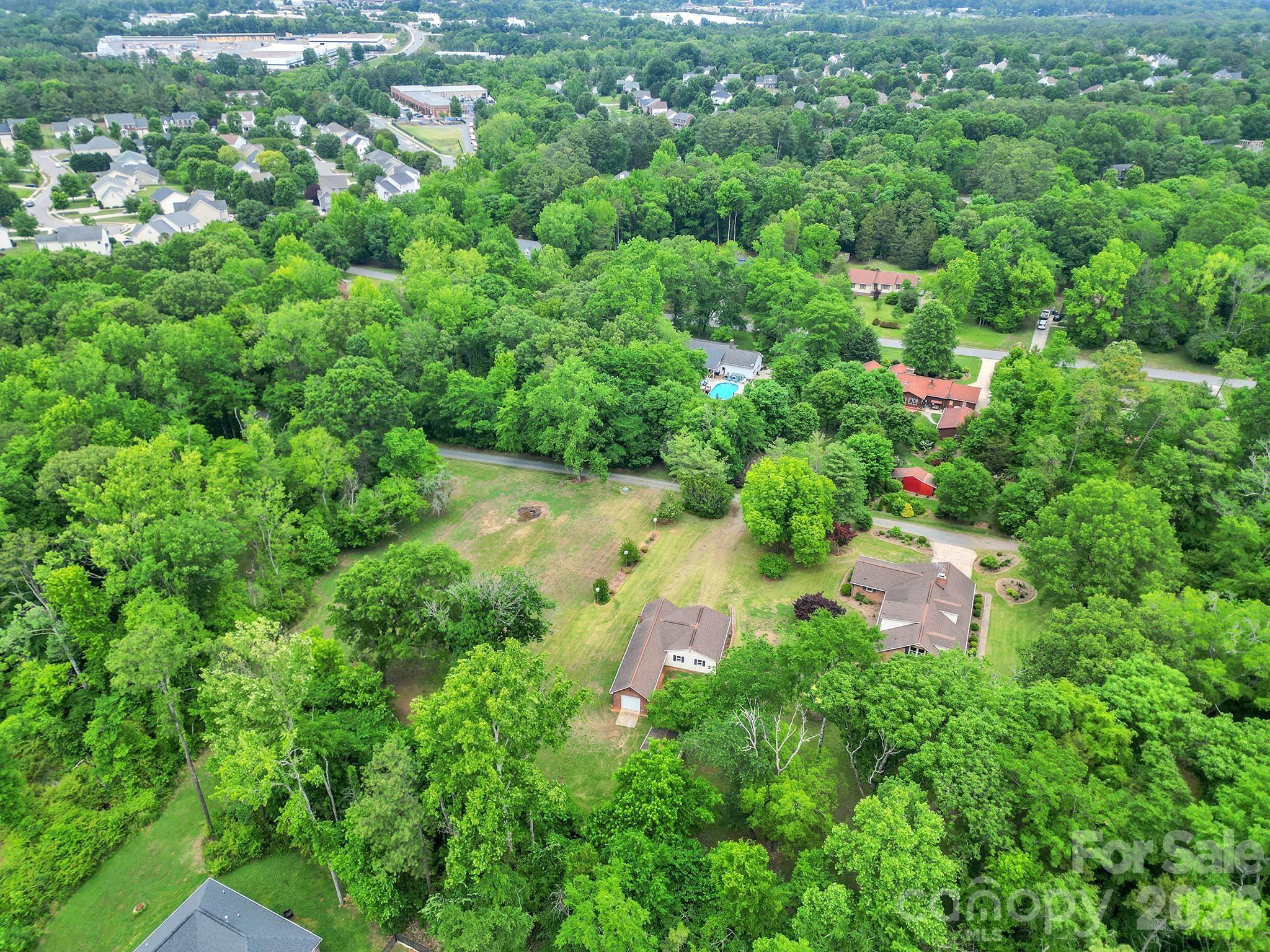 5913 Tom Query Road Charlotte, NC 28213 - Photo 46 of 47 an aerial view of residential house with outdoor space and trees all around