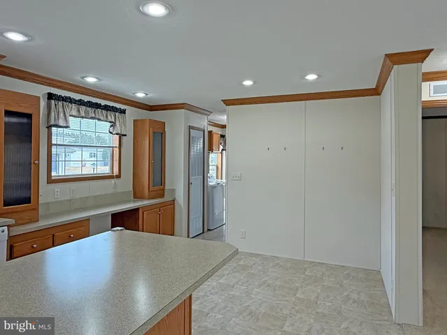 a view of a hallway with wooden door