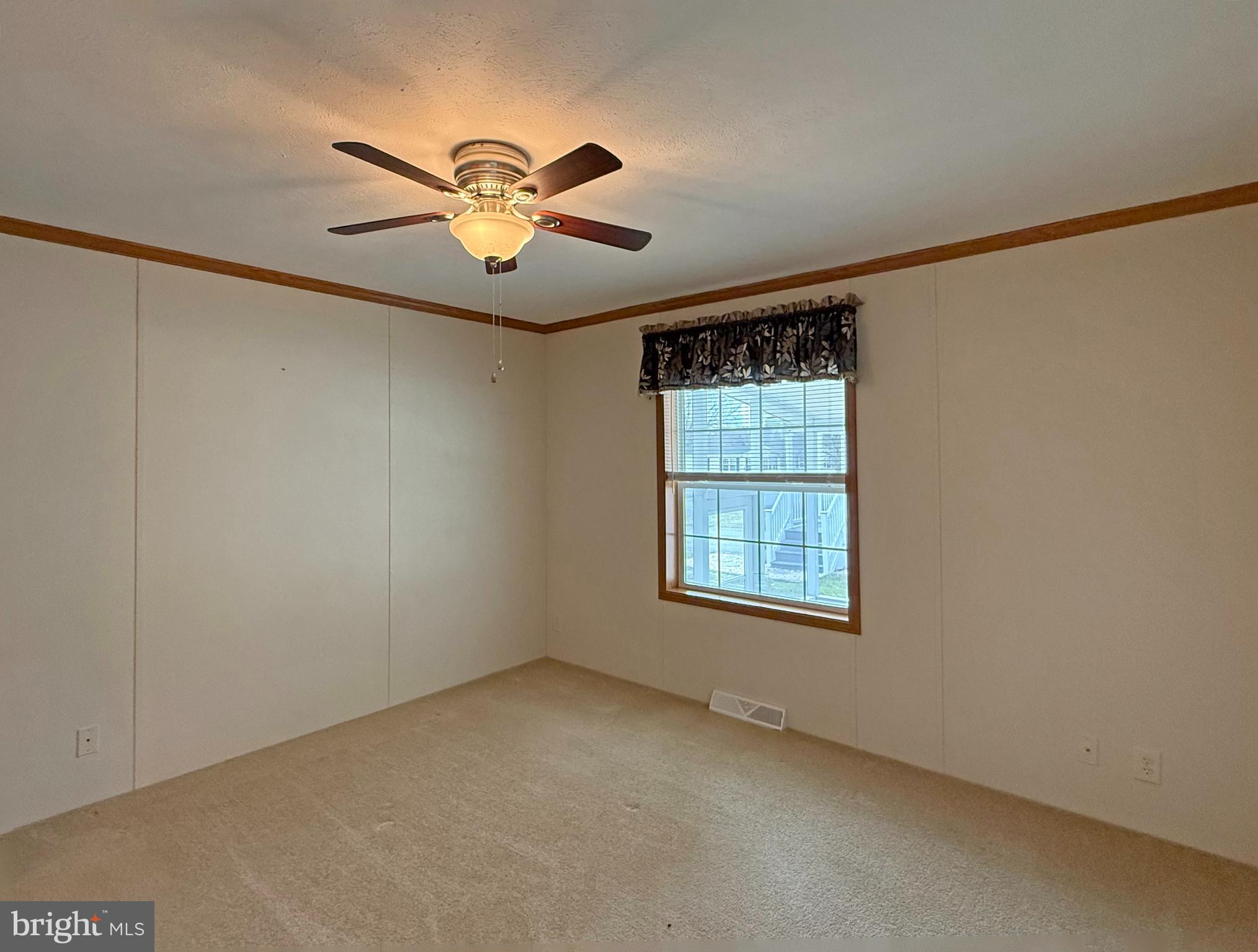 25 Baybreeze Road, Unit C29 Rehoboth Beach, DE 19971 - Photo 14 of 36 a view of an empty room with a window