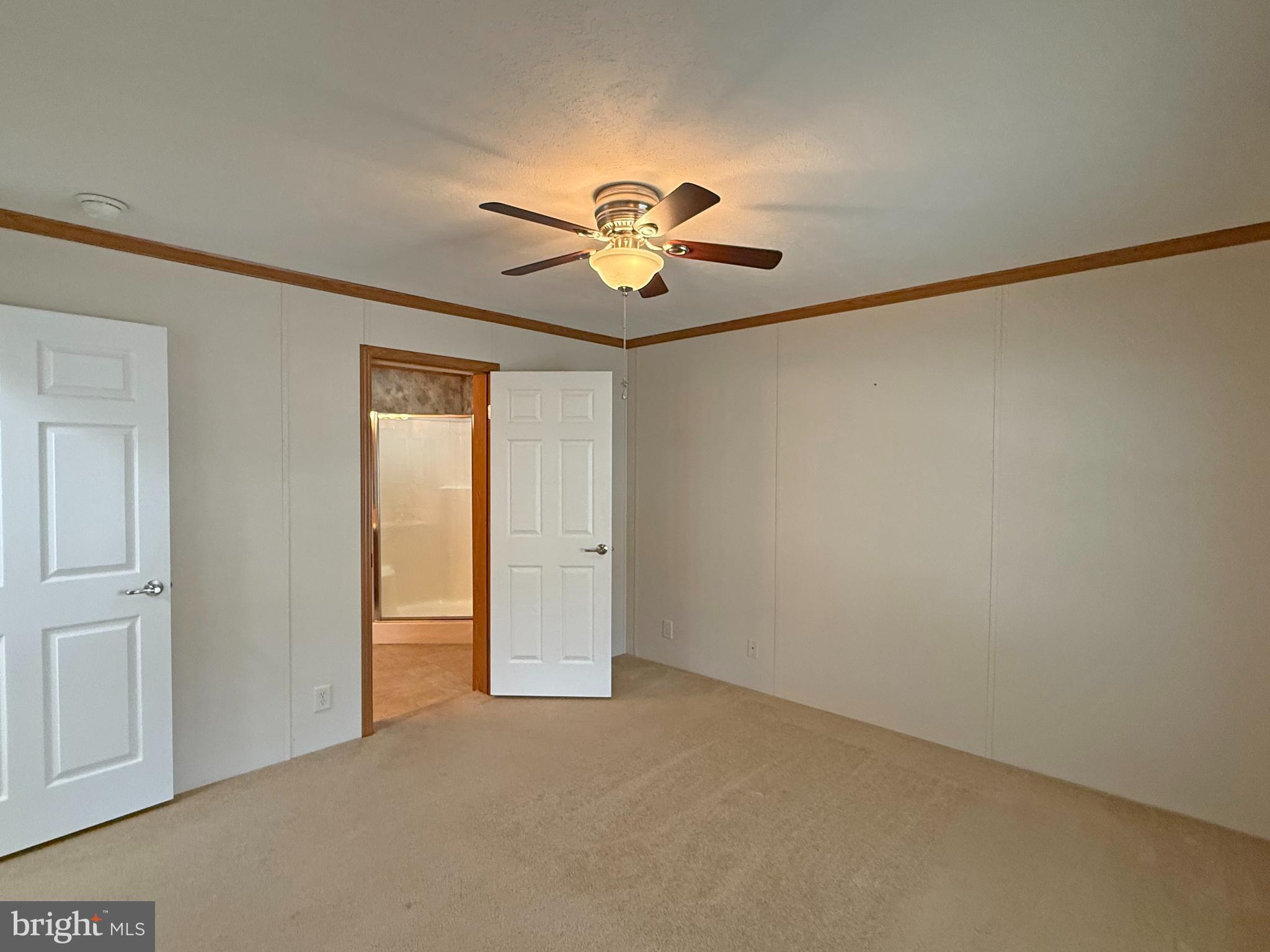25 Baybreeze Road, Unit C29 Rehoboth Beach, DE 19971 - Photo 15 of 36 a view of room with a ceiling fan