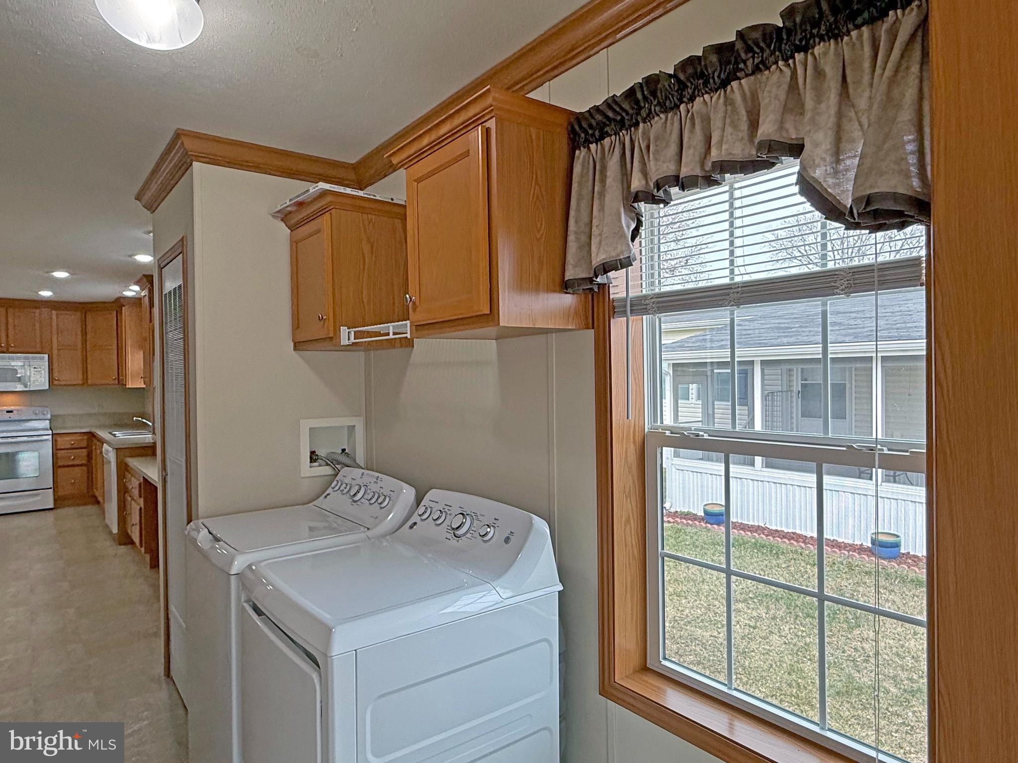 25 Baybreeze Road, Unit C29 Rehoboth Beach, DE 19971 - Photo 25 of 36 a utility room with dryer and washer