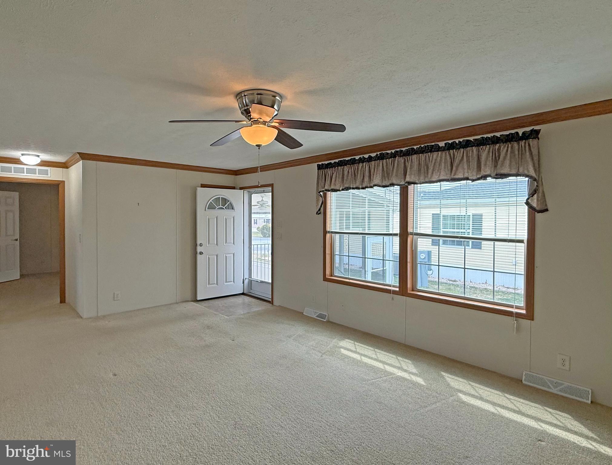 25 Baybreeze Road, Unit C29 Rehoboth Beach, DE 19971 - Photo 3 of 36 a view of an empty room with a window