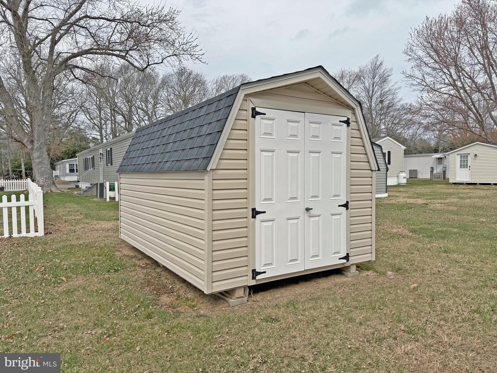 25 Baybreeze Road, Unit C29 Rehoboth Beach, DE 19971 - Photo 32 of 36 a front view of a house with a yard