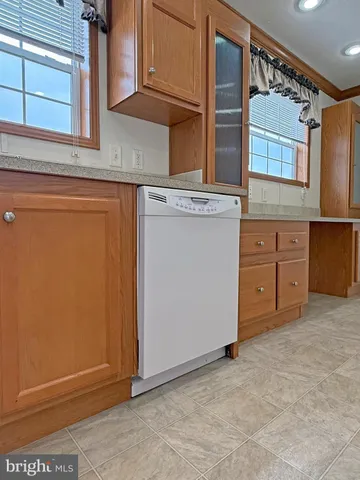 a white refrigerator freezer sitting inside of a kitchen