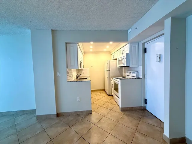 a view of a kitchen with kitchen