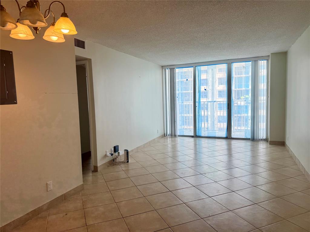 111 Briny Avenue, Unit 1805 Pompano Beach, FL 33062 - Photo 5 of 29 a view of an empty room with a window