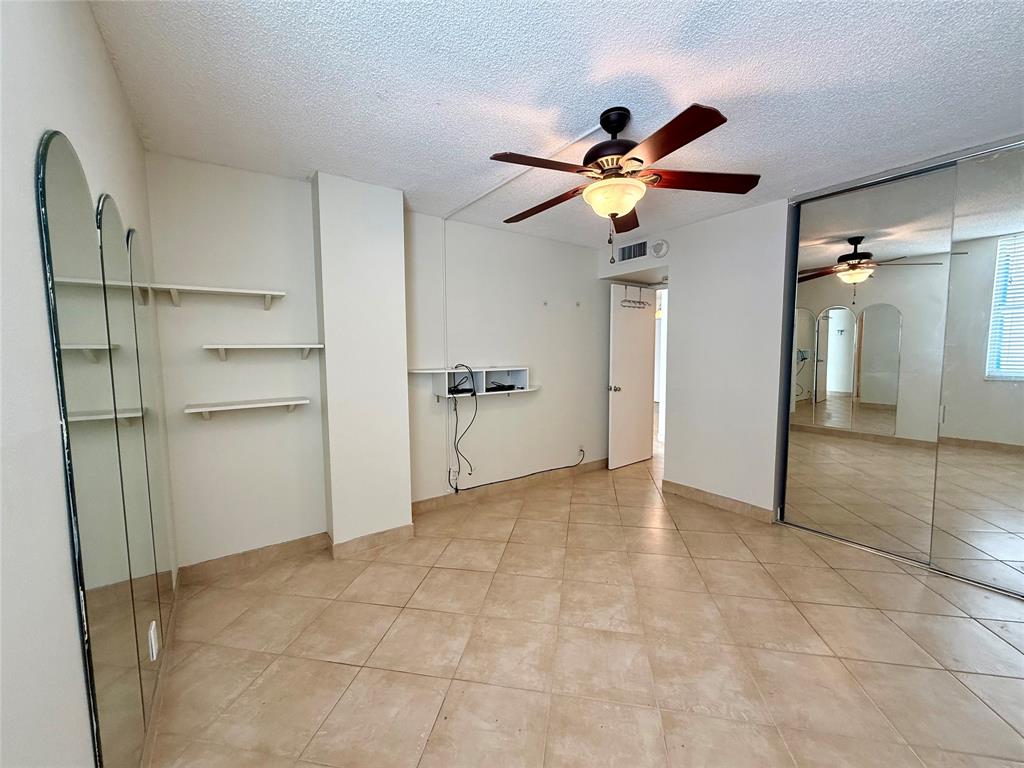 111 Briny Avenue, Unit 1805 Pompano Beach, FL 33062 - Photo 9 of 29 a view of an empty room