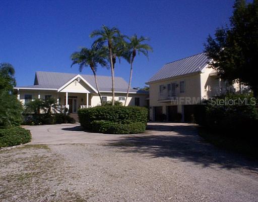 Exterior Front - CUSTOM ESTATE ON THE BEAUTIFUL PEACE RIVER, YOU WILL BE MOMENTS TO BOATING AND FISHING