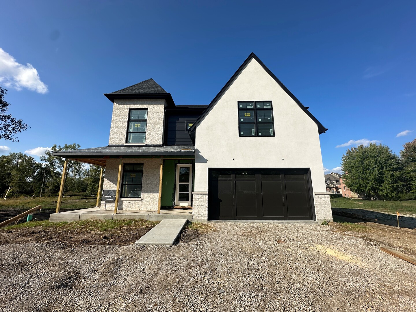 62 Miller Road Lake Zurich, IL 60047 - Photo 1 of 52 a front view of a house with a yard and garage