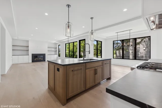 a kitchen with stainless steel appliances a stove sink and cabinets