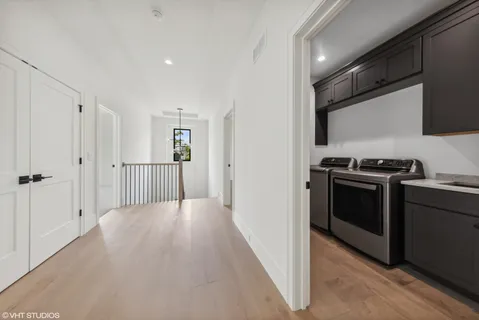 a spacious bathroom with a toilet sink and mirror