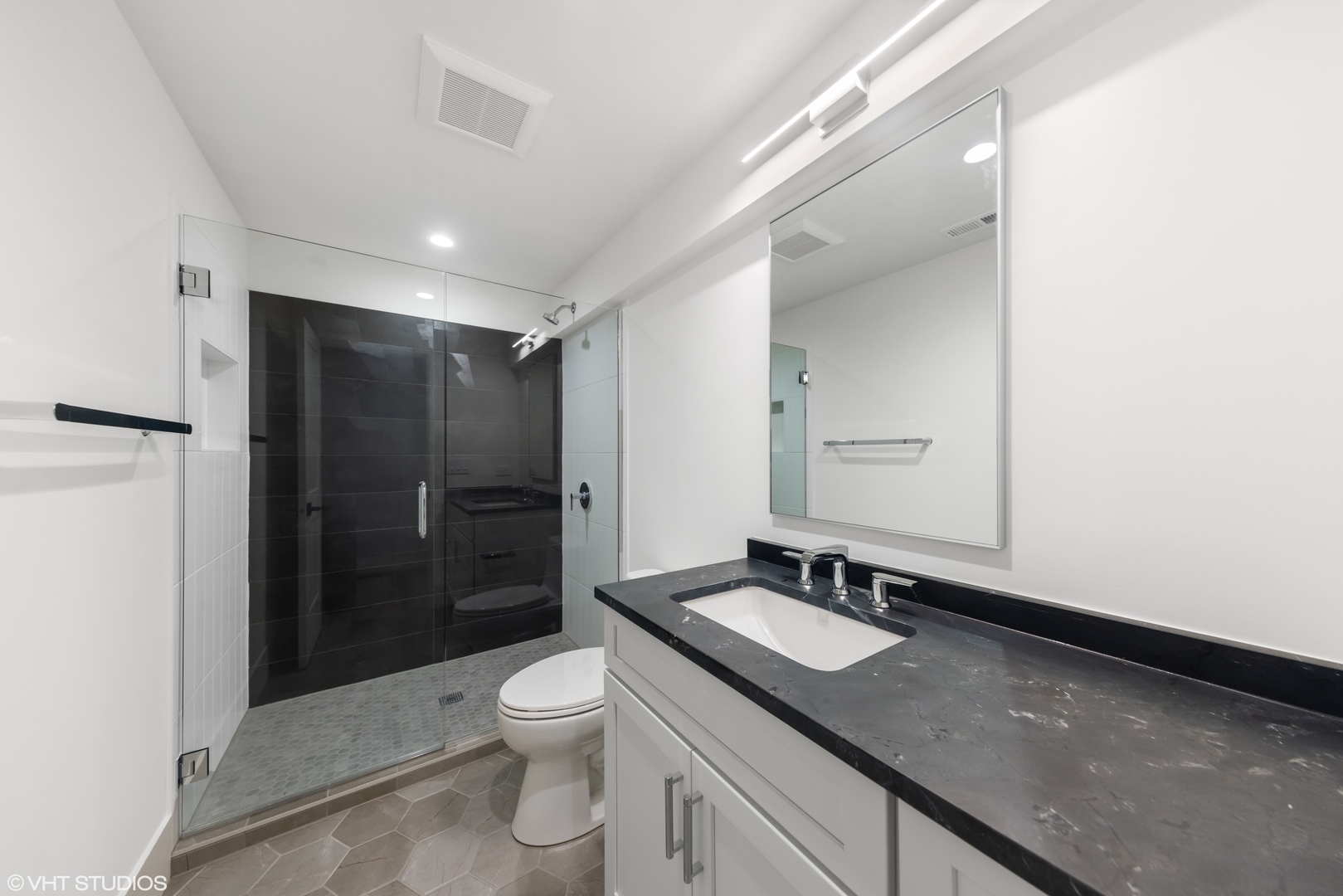 62 Miller Road Lake Zurich, IL 60047 - Photo 41 of 52 a bathroom with a sink shower toilet and a mirror