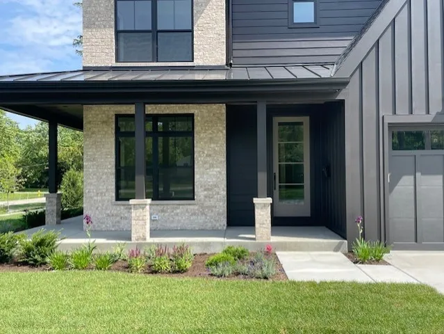 a front view of a house with garden
