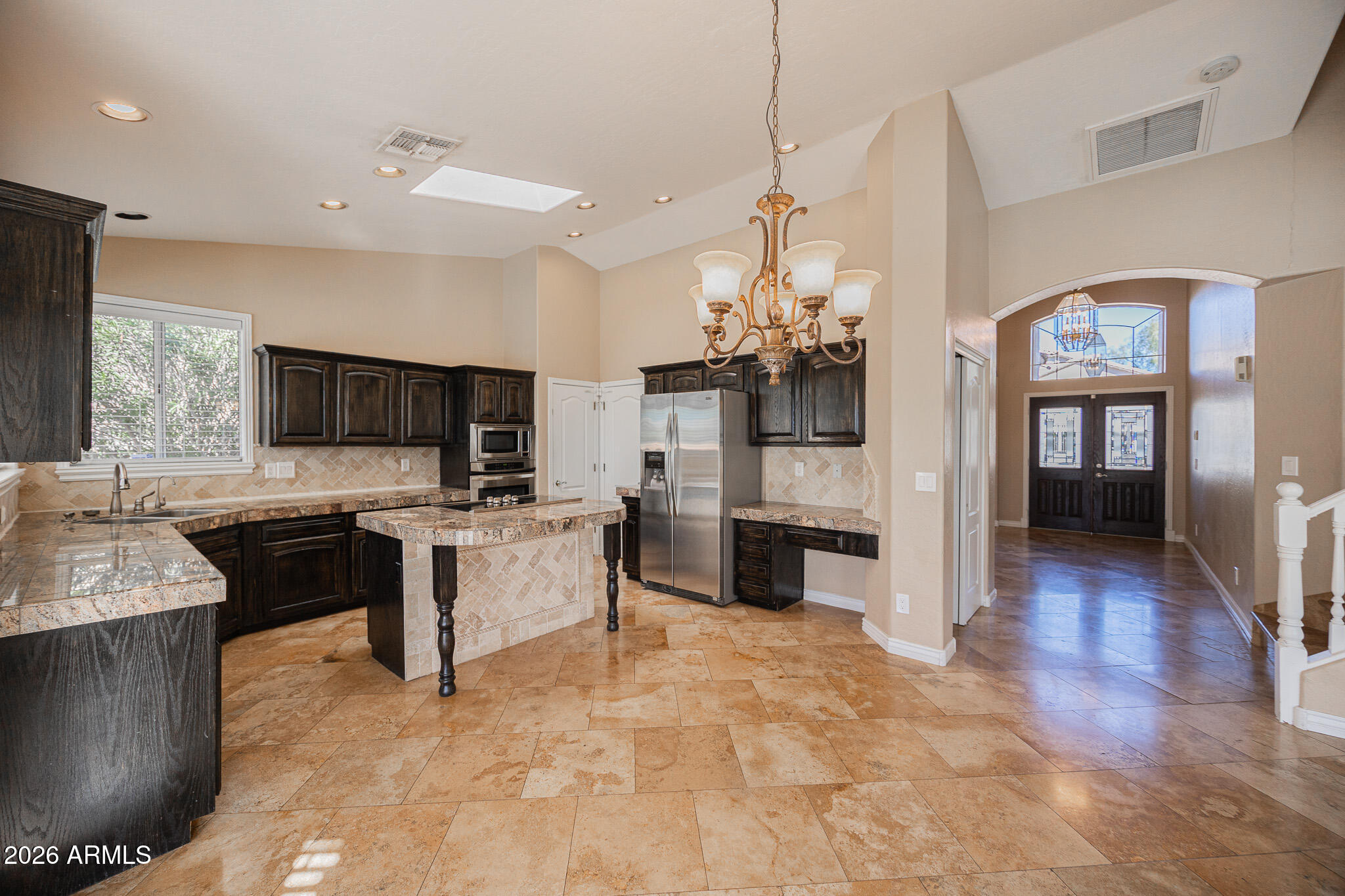 1767 West Redfield Road Gilbert, AZ 85233 - Photo 11 of 40 a large kitchen with a counter space a sink appliances and cabinets