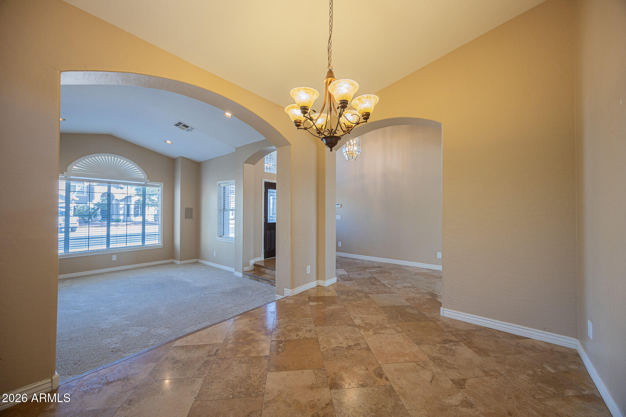 1767 West Redfield Road Gilbert, AZ 85233 - Photo 14 of 40 a view of a livingroom with a chandelier fan and windows