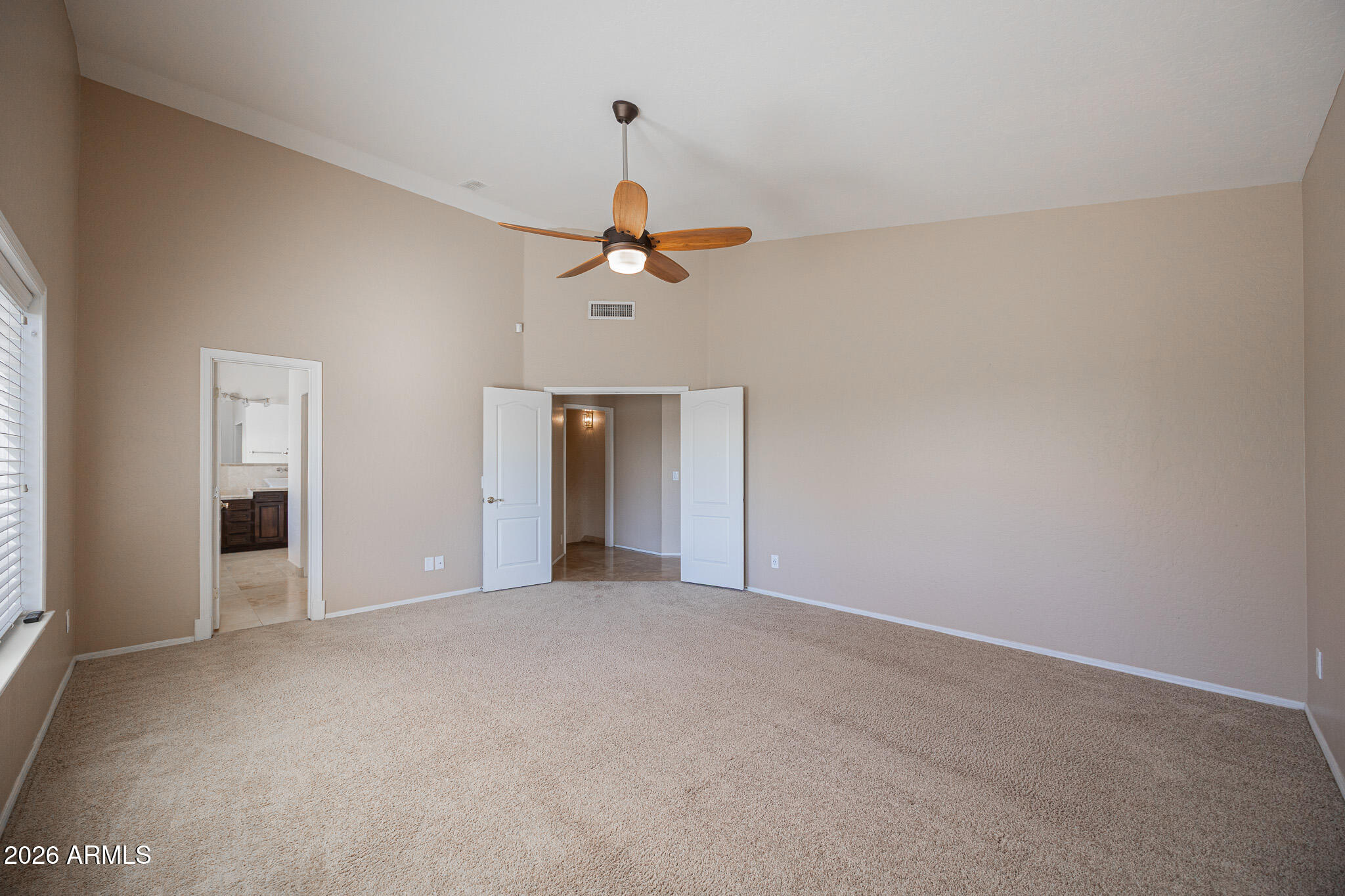 1767 West Redfield Road Gilbert, AZ 85233 - Photo 18 of 40 a view of a livingroom with a ceiling fan and window