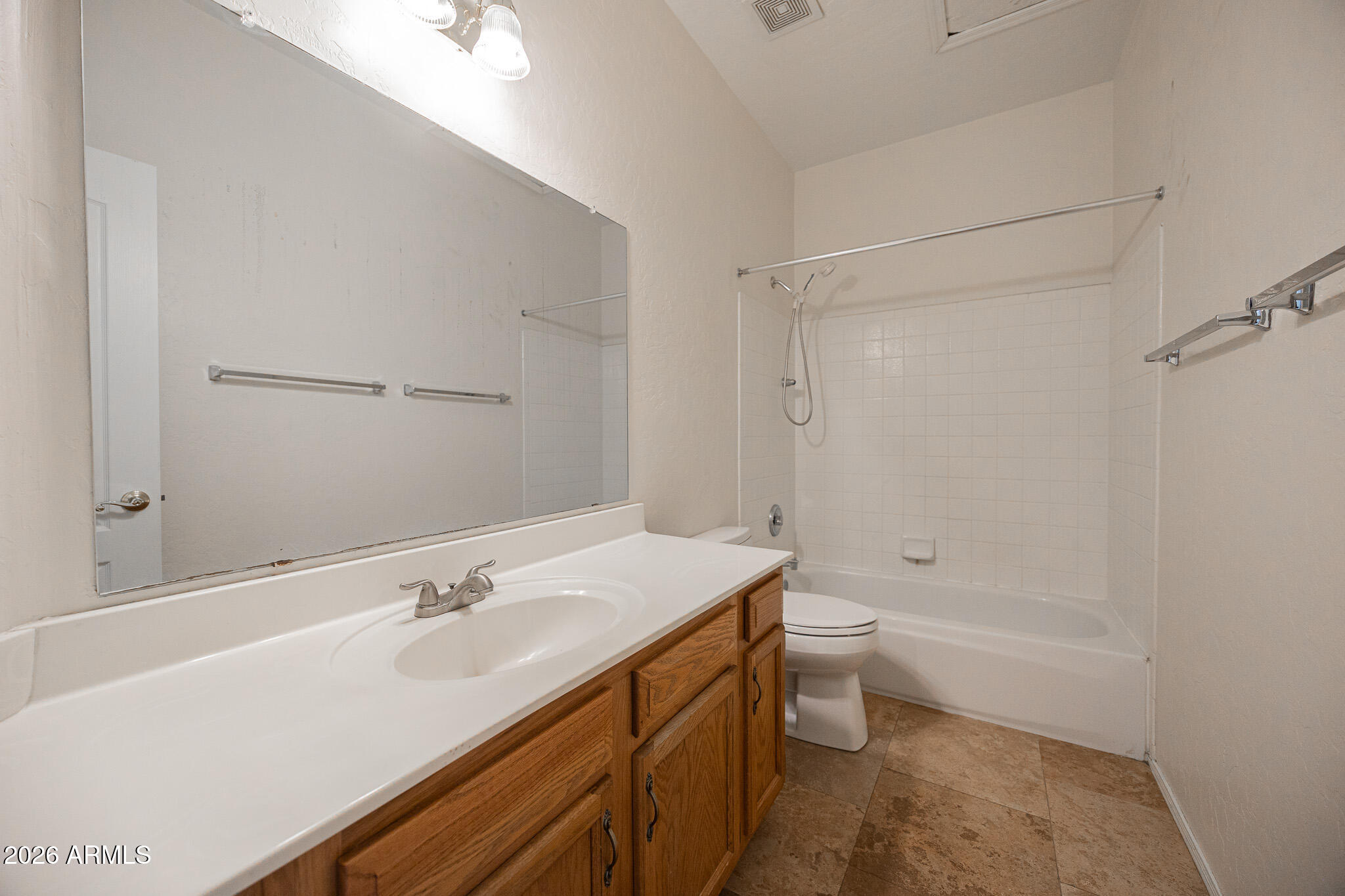 1767 West Redfield Road Gilbert, AZ 85233 - Photo 27 of 40 a bathroom with a sink a toilet and shower