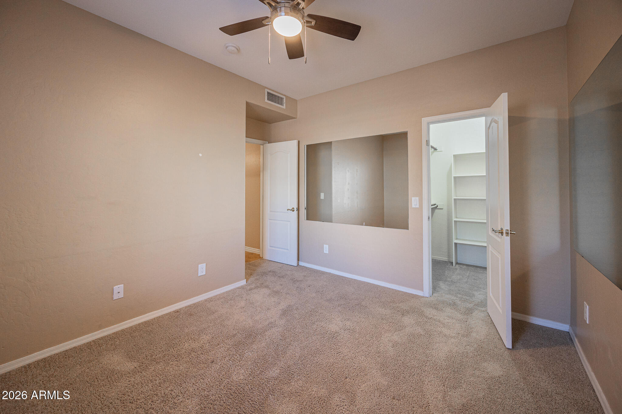 1767 West Redfield Road Gilbert, AZ 85233 - Photo 32 of 40 an empty room with fan and entrance