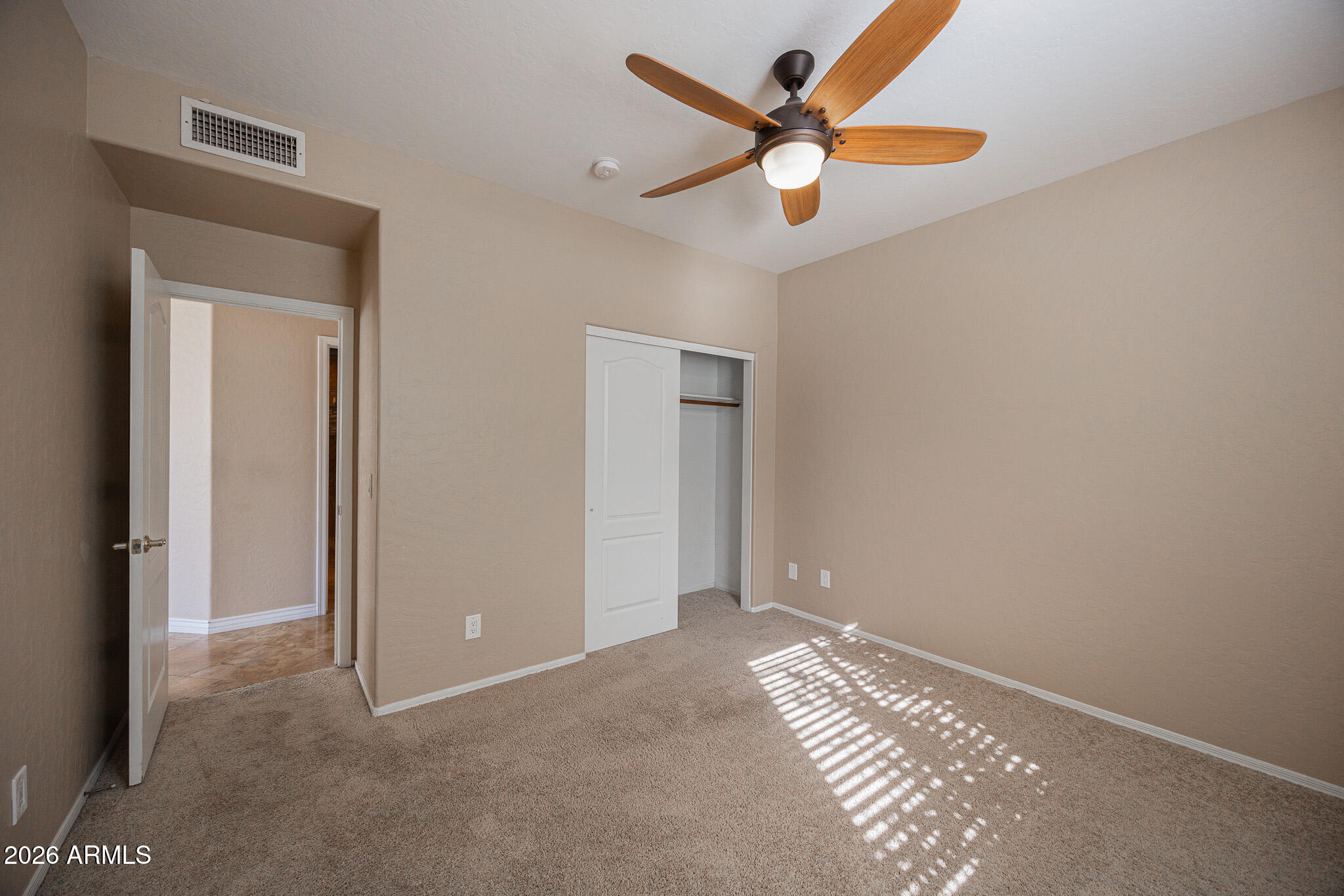 1767 West Redfield Road Gilbert, AZ 85233 - Photo 34 of 40 an empty room with closet and fan