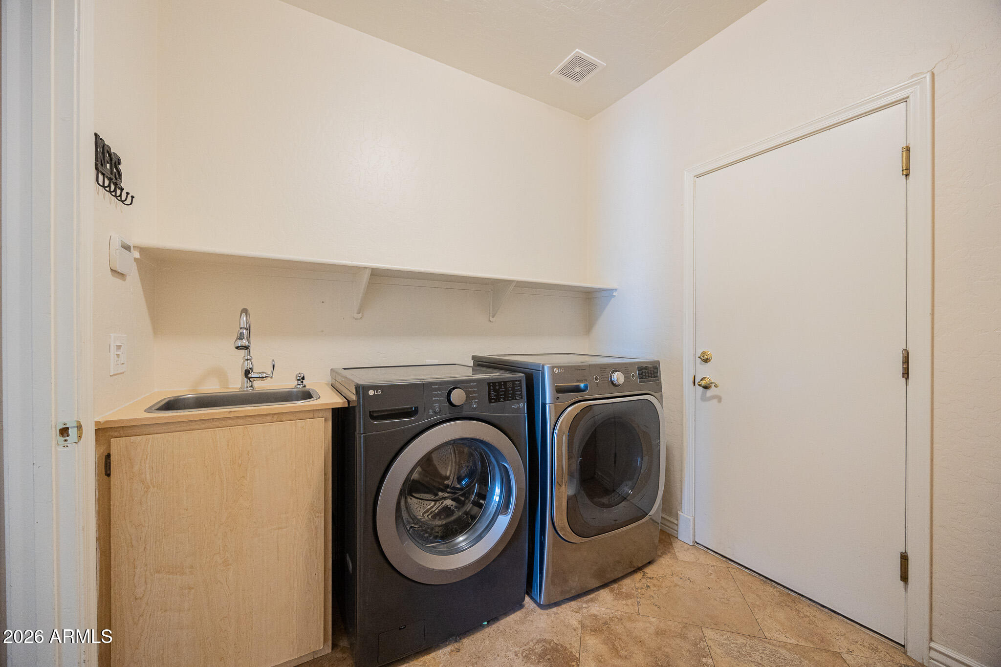 1767 West Redfield Road Gilbert, AZ 85233 - Photo 35 of 40 a utility room with dryer and washer