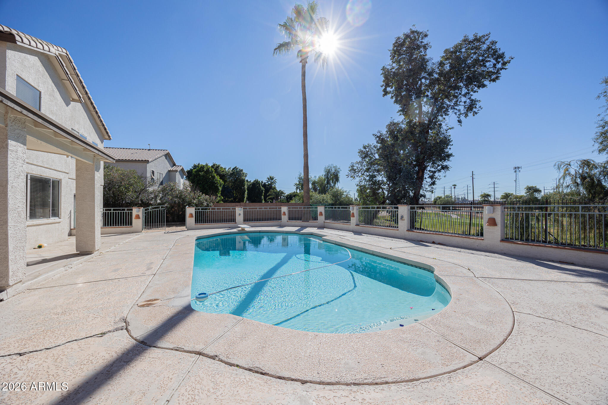1767 West Redfield Road Gilbert, AZ 85233 - Photo 38 of 40 a view of a swimming pool with a chair