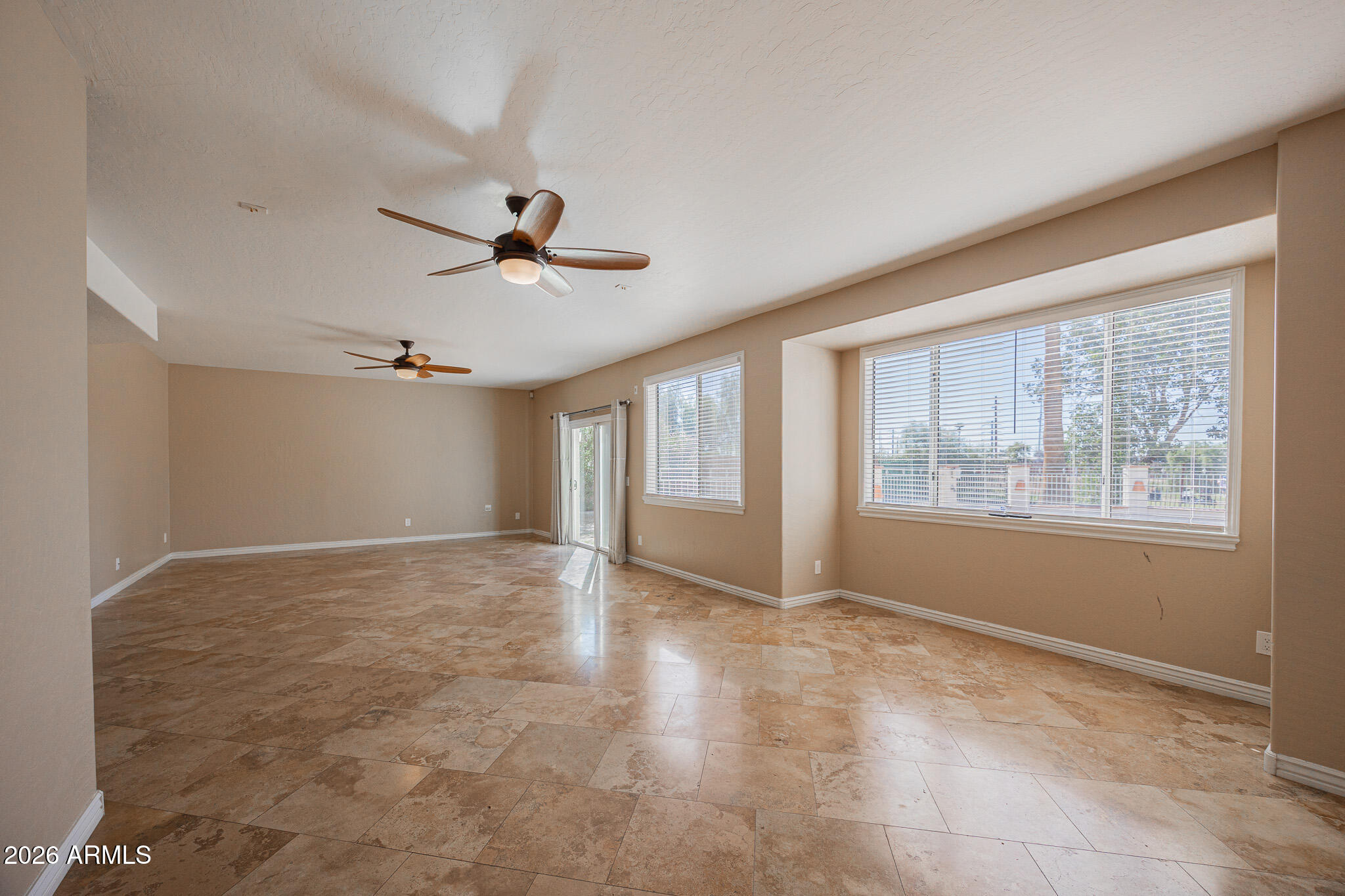 1767 West Redfield Road Gilbert, AZ 85233 - Photo 4 of 40 a view of an empty room with a window