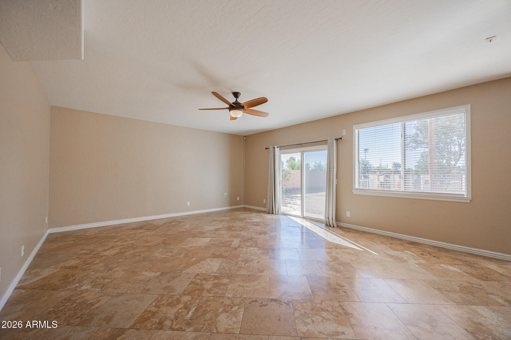1767 West Redfield Road Gilbert, AZ 85233 - Photo 5 of 40 a view of an empty room with a window