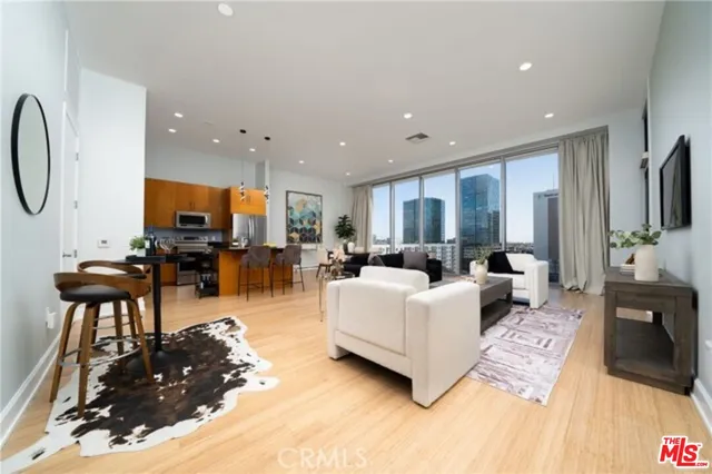 a living room with lots of furniture and a flat screen tv