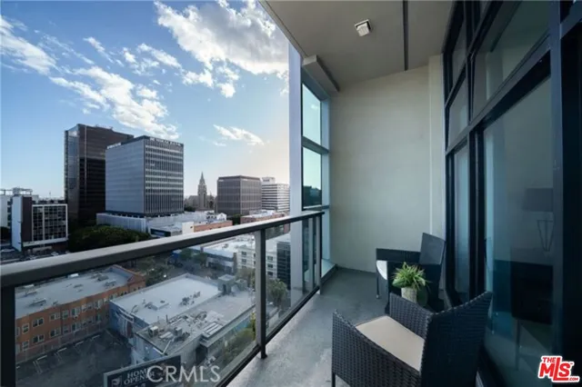 a bathroom with a granite countertop sink a mirror a vanity and shower