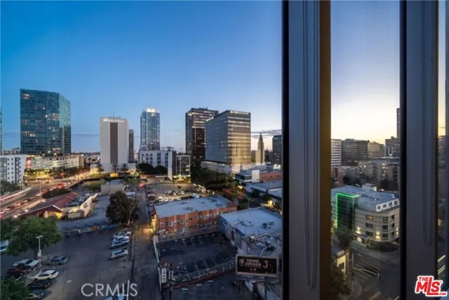 a bathroom with a granite countertop sink a toilet and a mirror