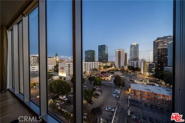 a bathroom with a granite countertop sink a toilet and a mirror