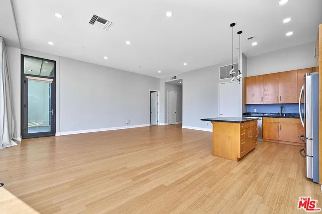 a view of an empty room with a closet